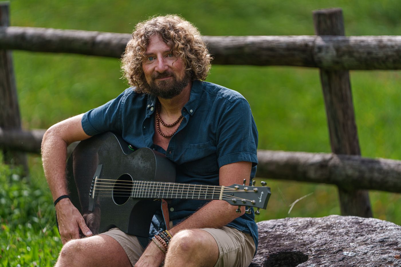 Pat playing guitar, portrait